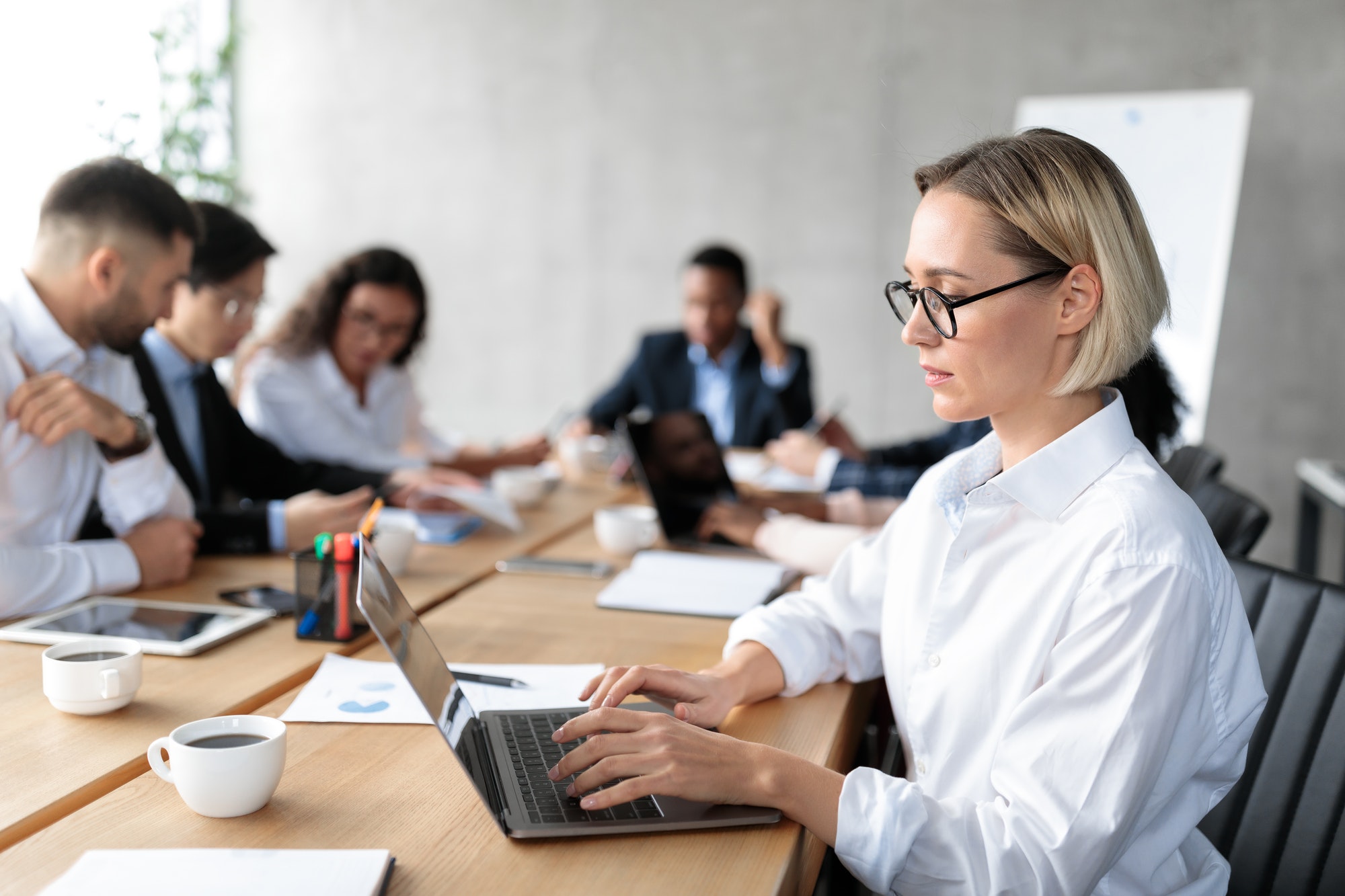 Businesswoman Using Laptop On Corporate Meeting Working Sitting In Office