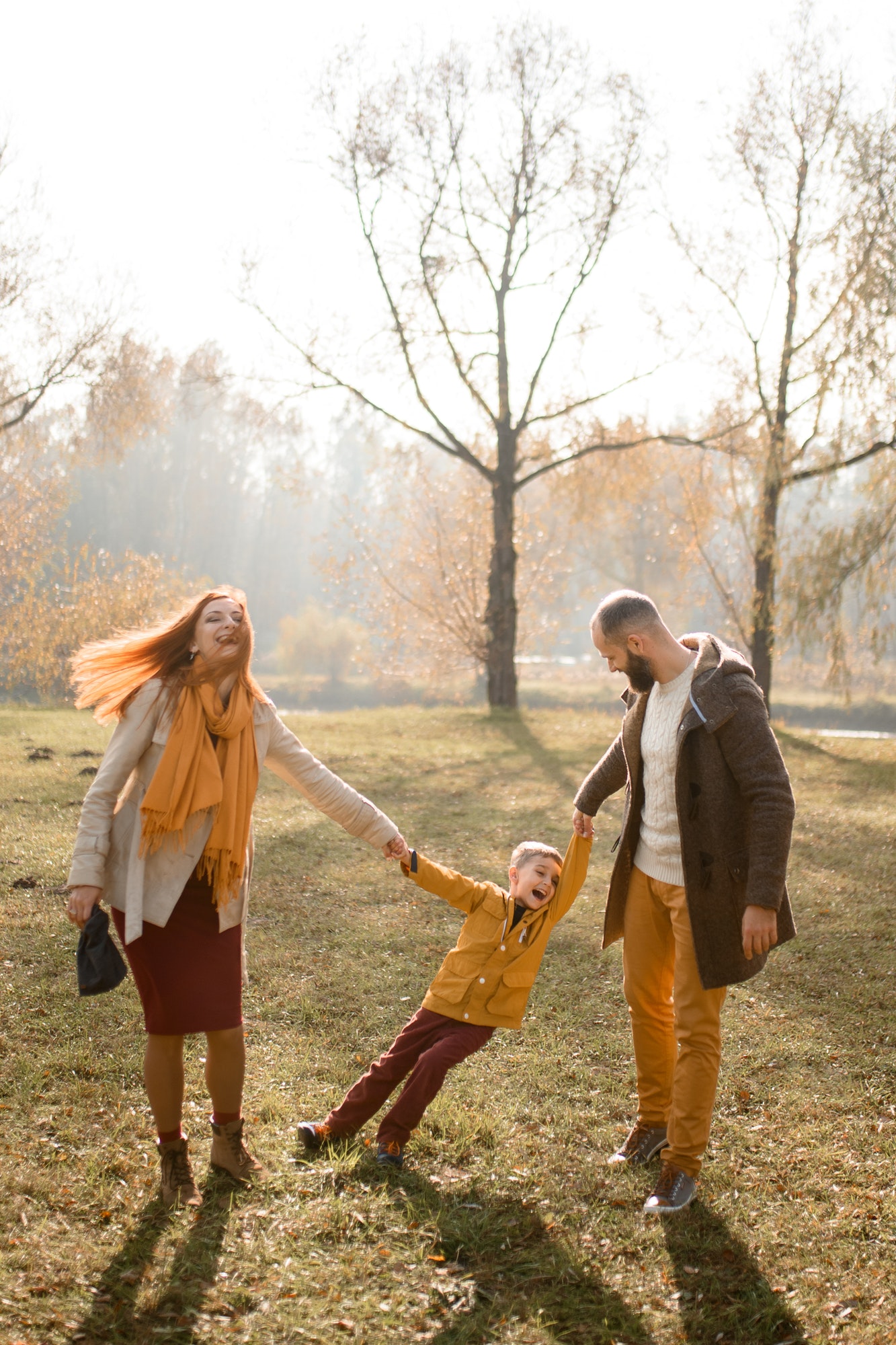 Happy family is playing in nature.